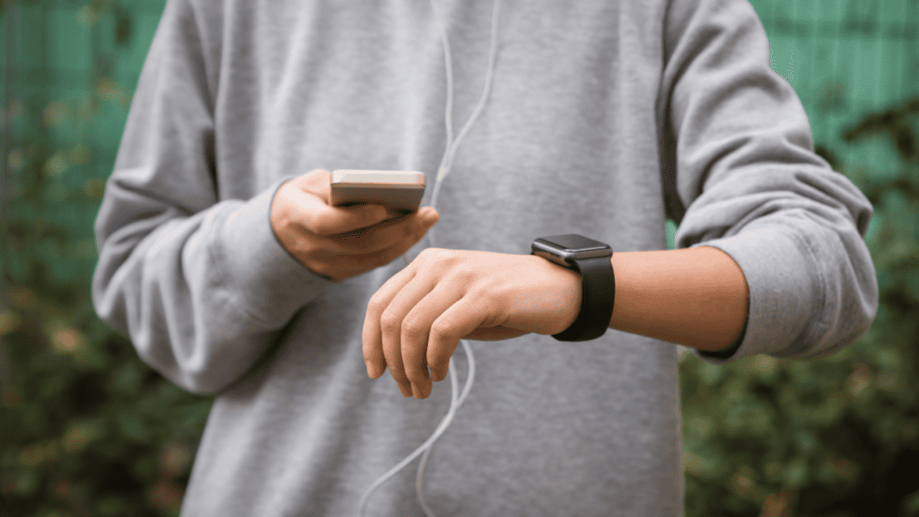 image of a person using an Apple Watch to track fitness trend