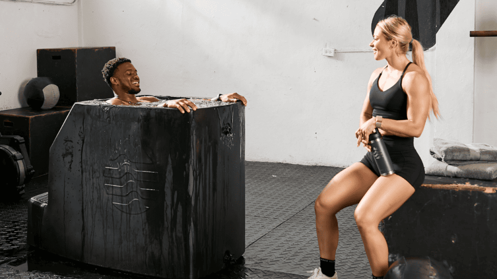 an image of a person sitting in the larger Ice Barrel 500 that can accommodate someone up to 7 feet tall.